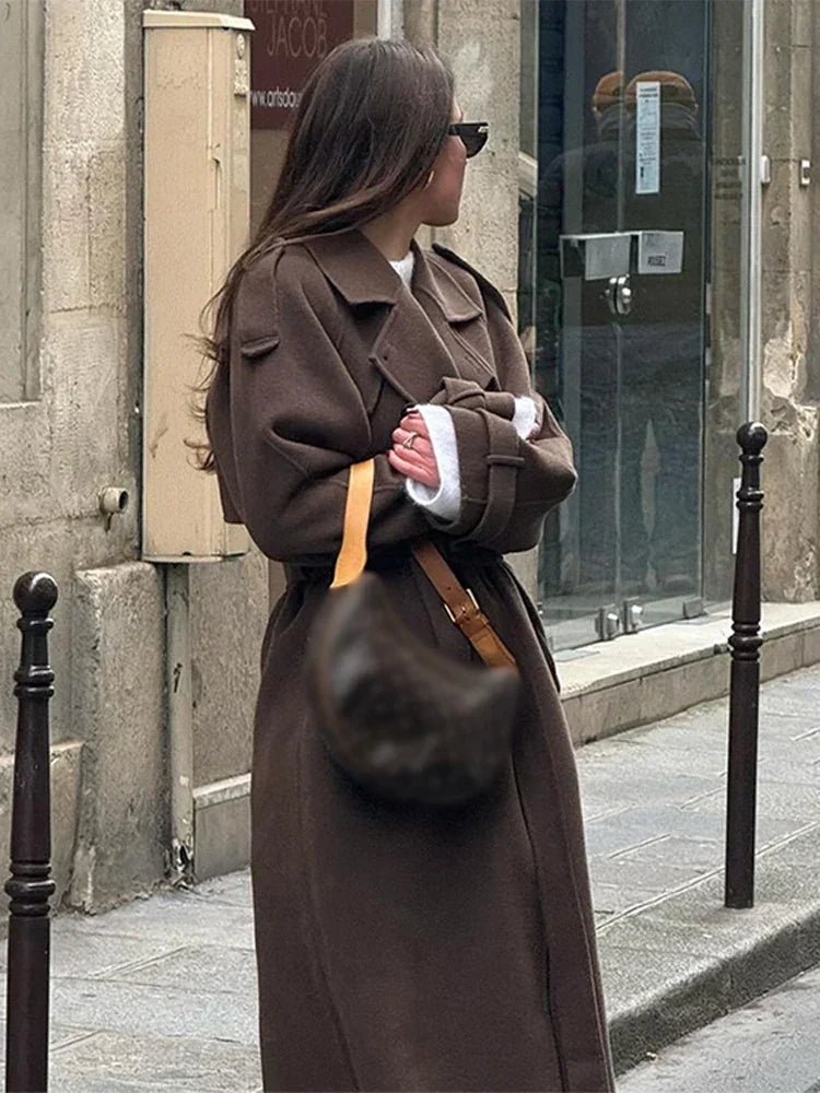 Women's oversized double-breasted trench coat with waist belt and notched collar
